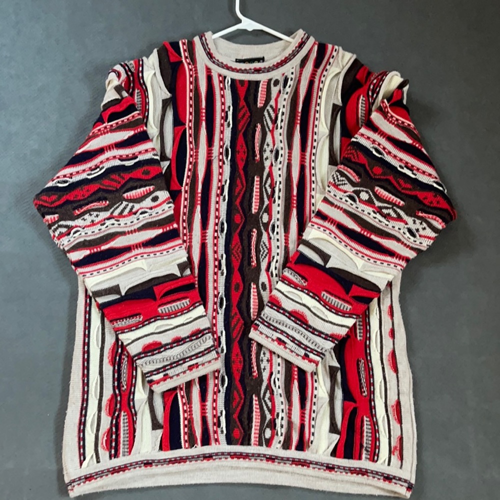 Coogi crewneck sweater. Multi colors red, blue, brown.
